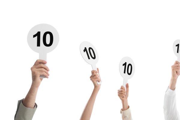judges hold score cards showing 10
