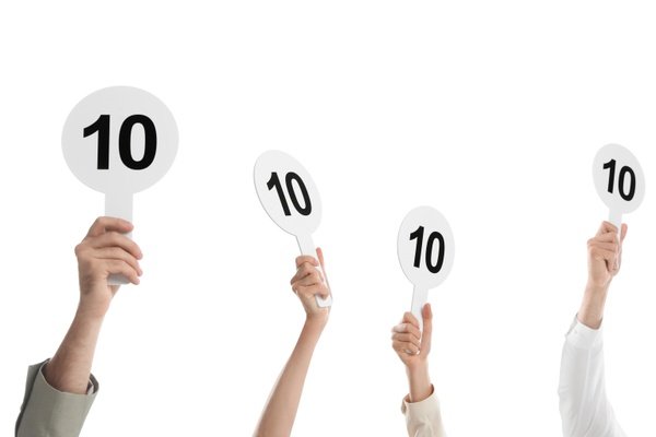 judges hold score cards showing 10