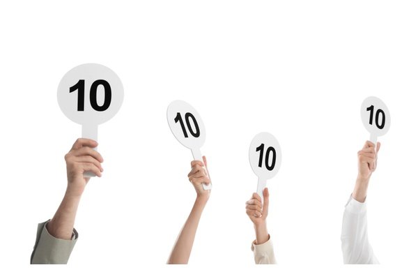 judges hold score cards showing 10