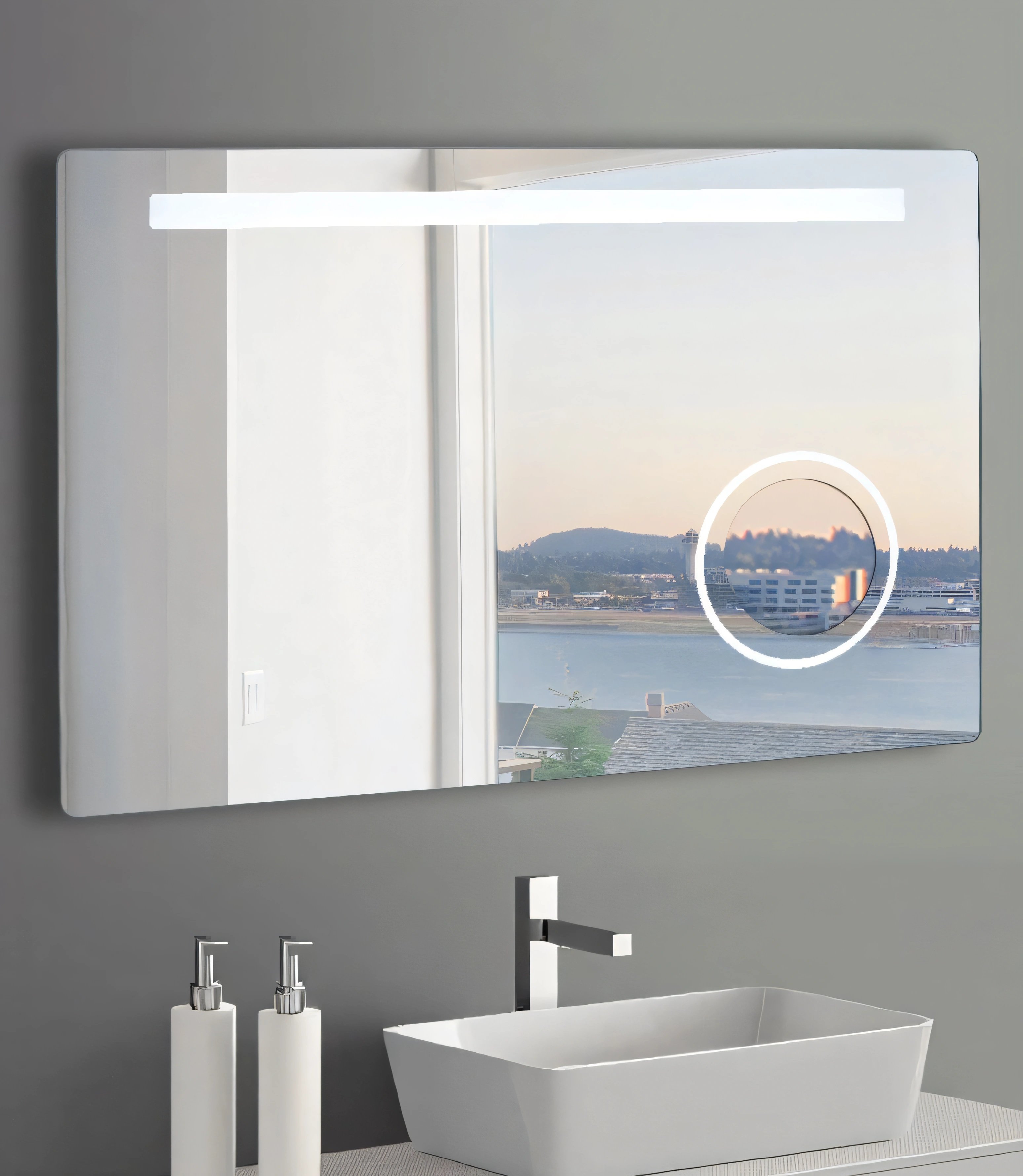 Judy LED bathroom mirror with magnifying mirror and defogger above a modern vanity