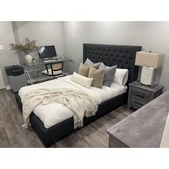 A bedroom and home office interior featuring gray wood-look plank flooring suitable for electric radiant floor heating.