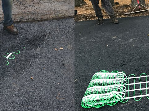 Laying out snow melting mats on asphalt driveway Step 5: Laying out mats