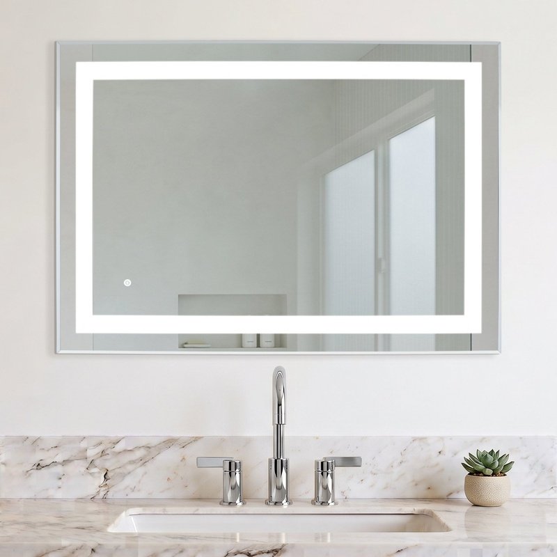 Audrey 40x28 LED backlit bathroom mirror with a frosted light border mounted on a beige marble wall above a vanity.