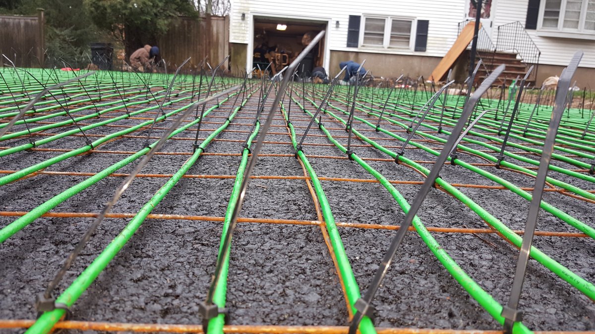 Lotacki Snow Melt Cable Installation 1 close up of snow melt cable zip tied to metal grid