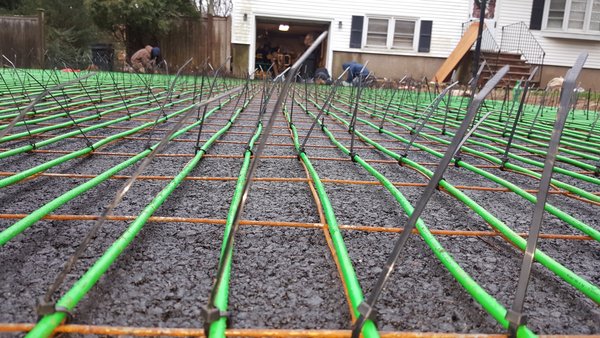 Lotacki Snow Melt Cable Installation 1 close up of snow melt cable zip tied to metal grid