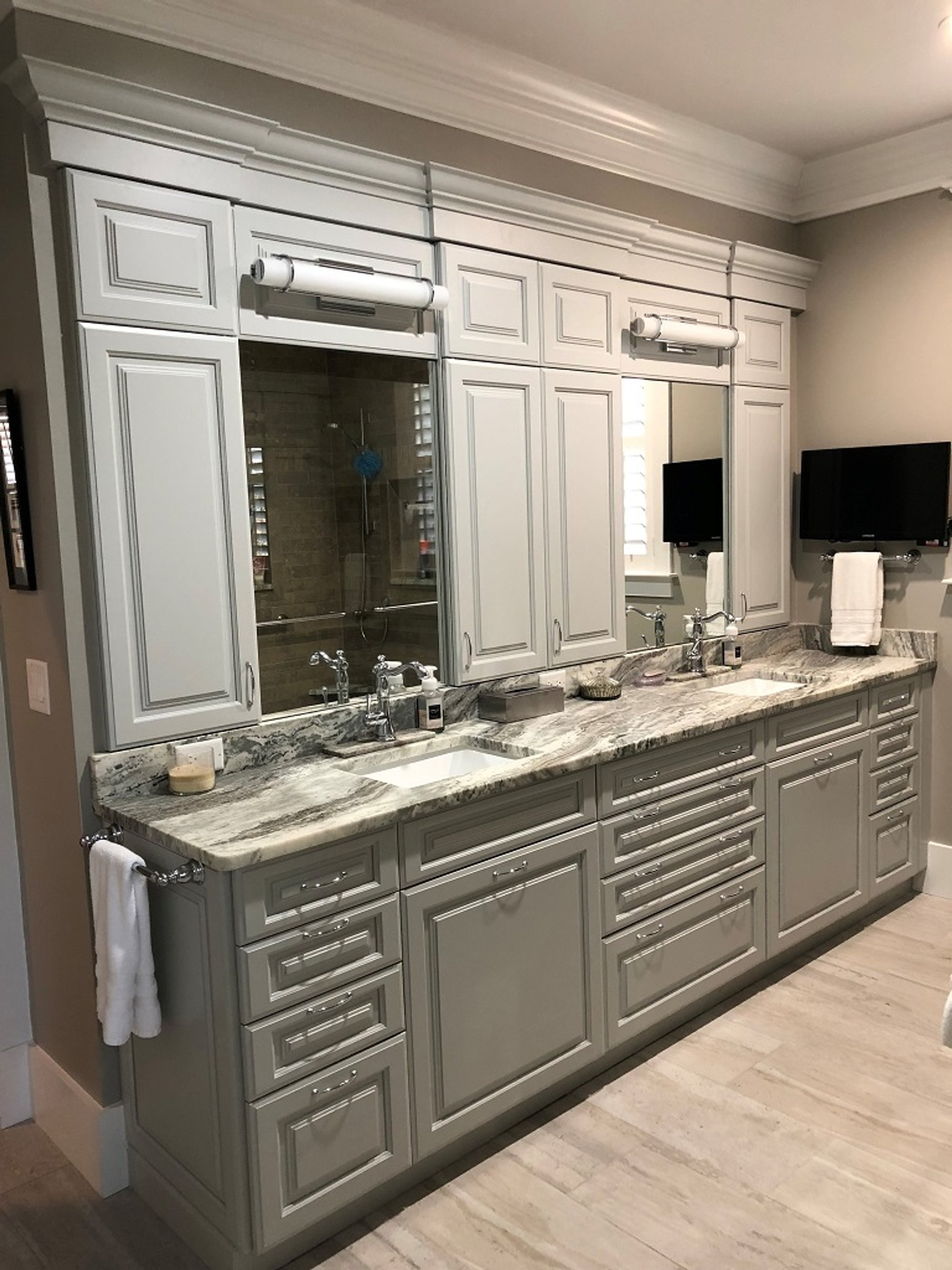 Luxury bathroom vanity with heated flooring by Winslow Design Studio