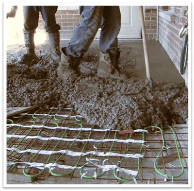 Pouring concrete over snow melt installation