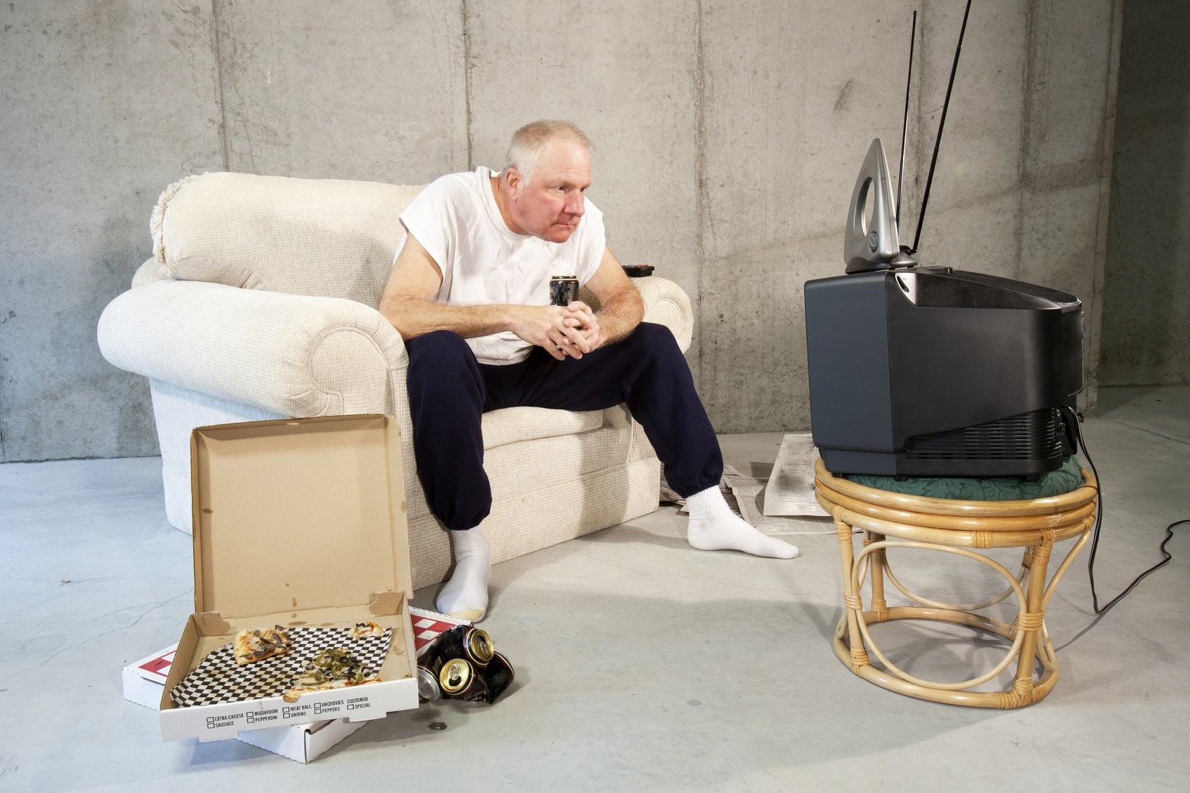 Man watching television on a couch