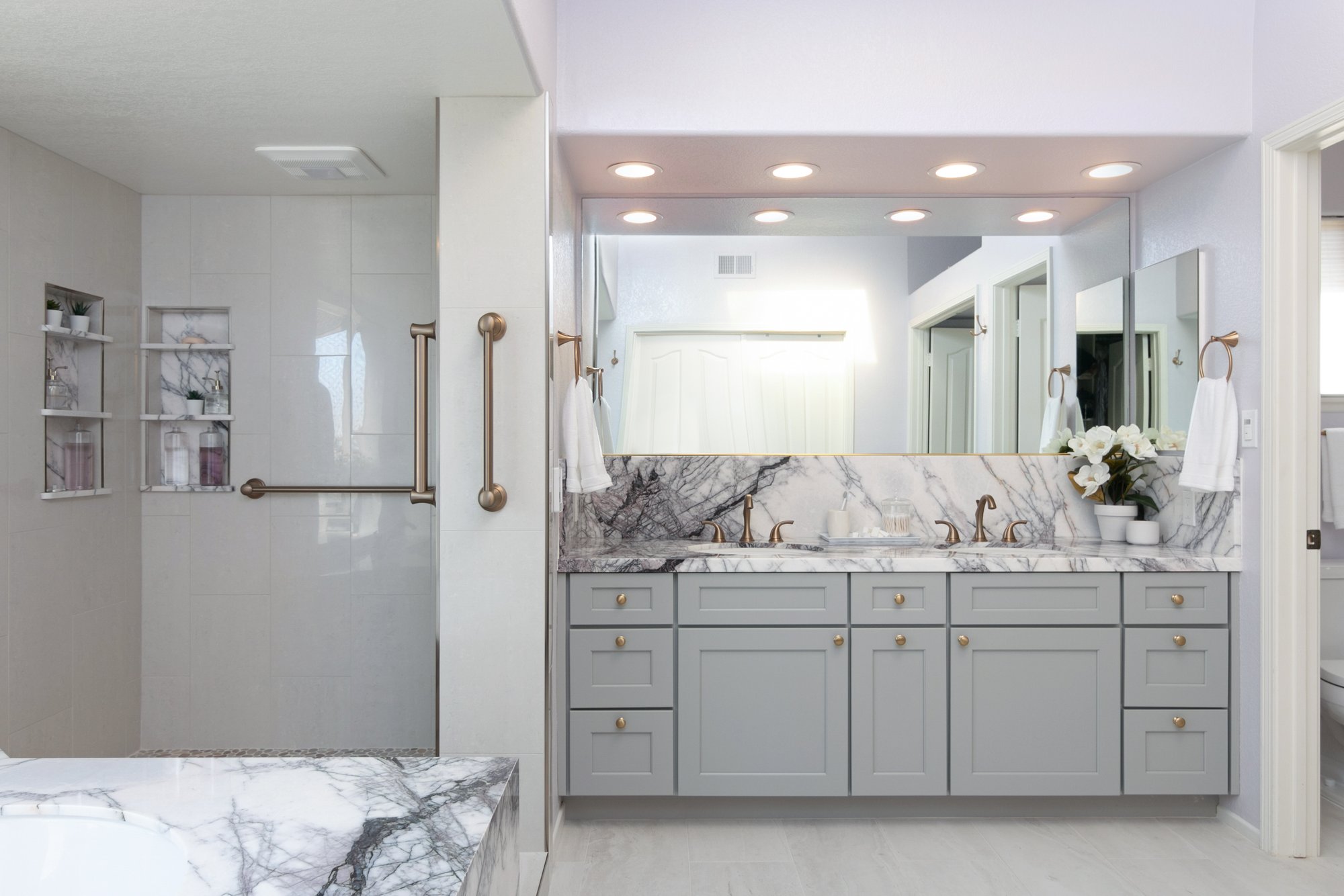 Marble master bath with electric floor heating vanity and shower shot by kitchen places of ventura