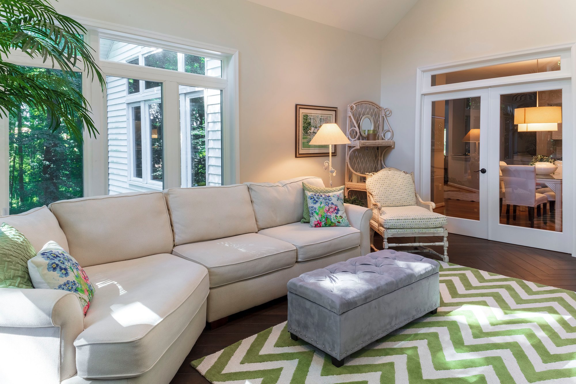 Sunroom with electric floor heating near entrance from main house