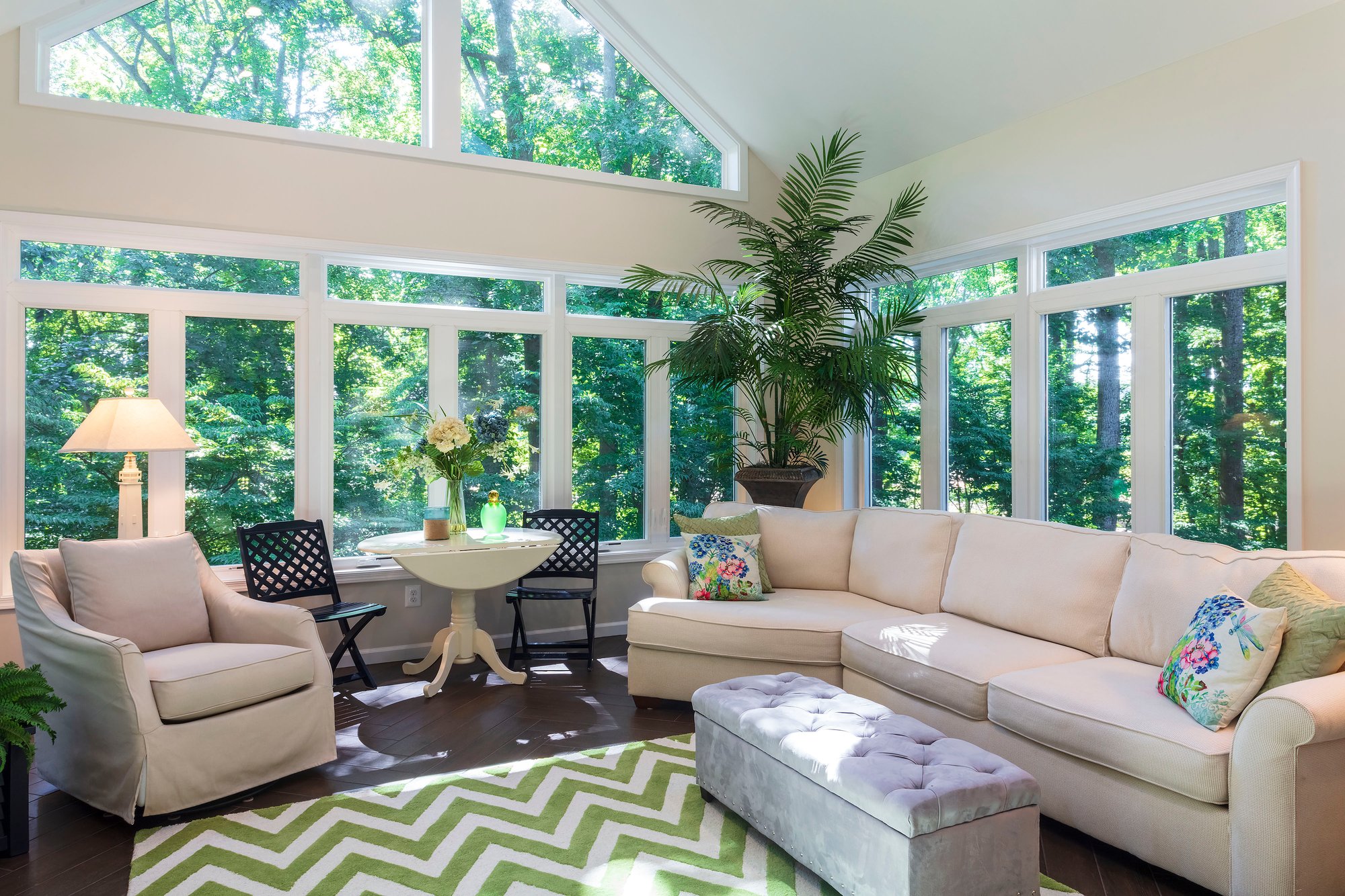 Sunroom with electric floor heating and palm tree