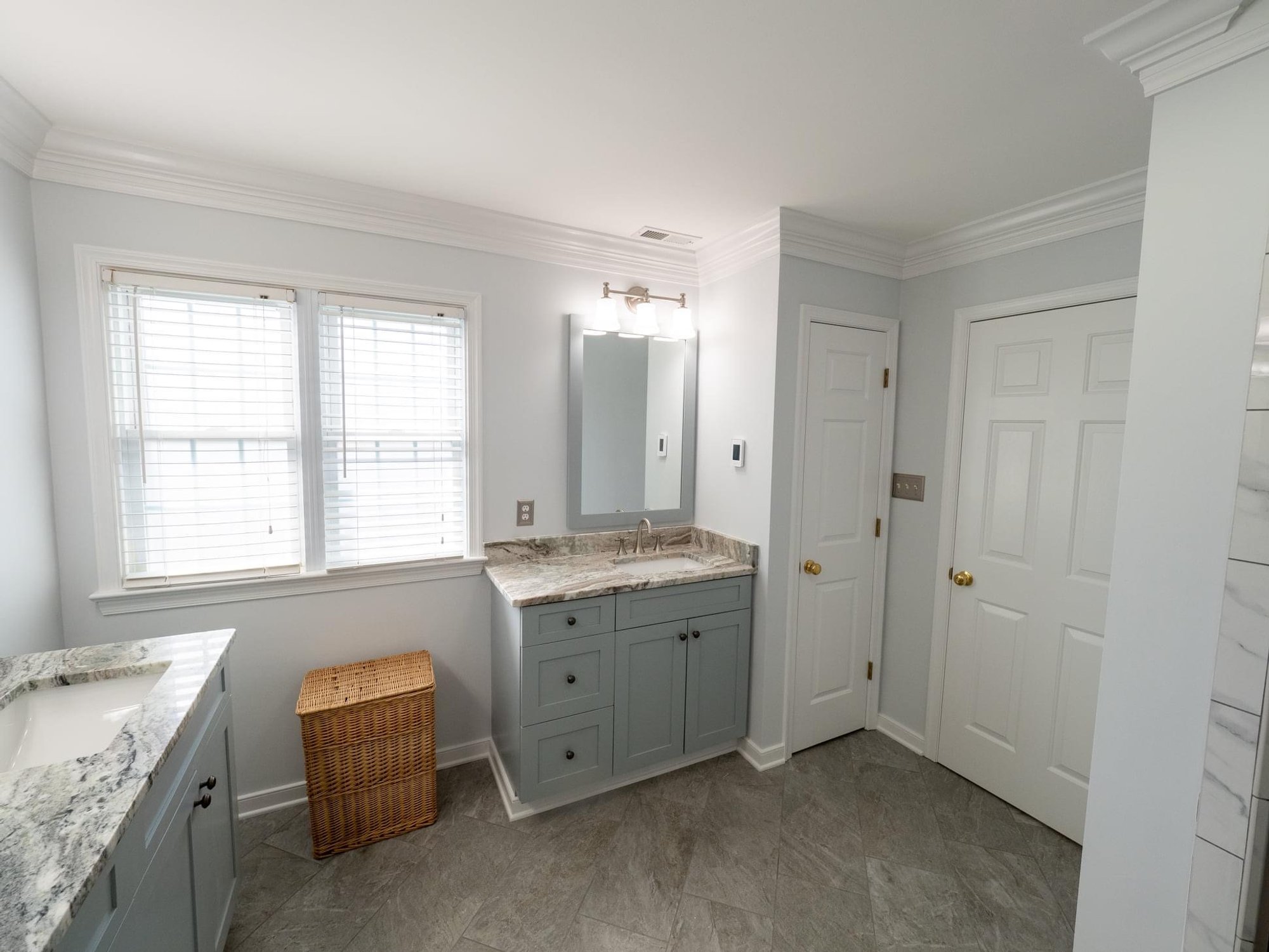 Master bath remodel with electric floor heating entryway and linen closet