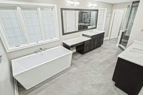 Master Bath remodel with tempzone flex roll floor heating bathtub and vanities by red oak remodeling