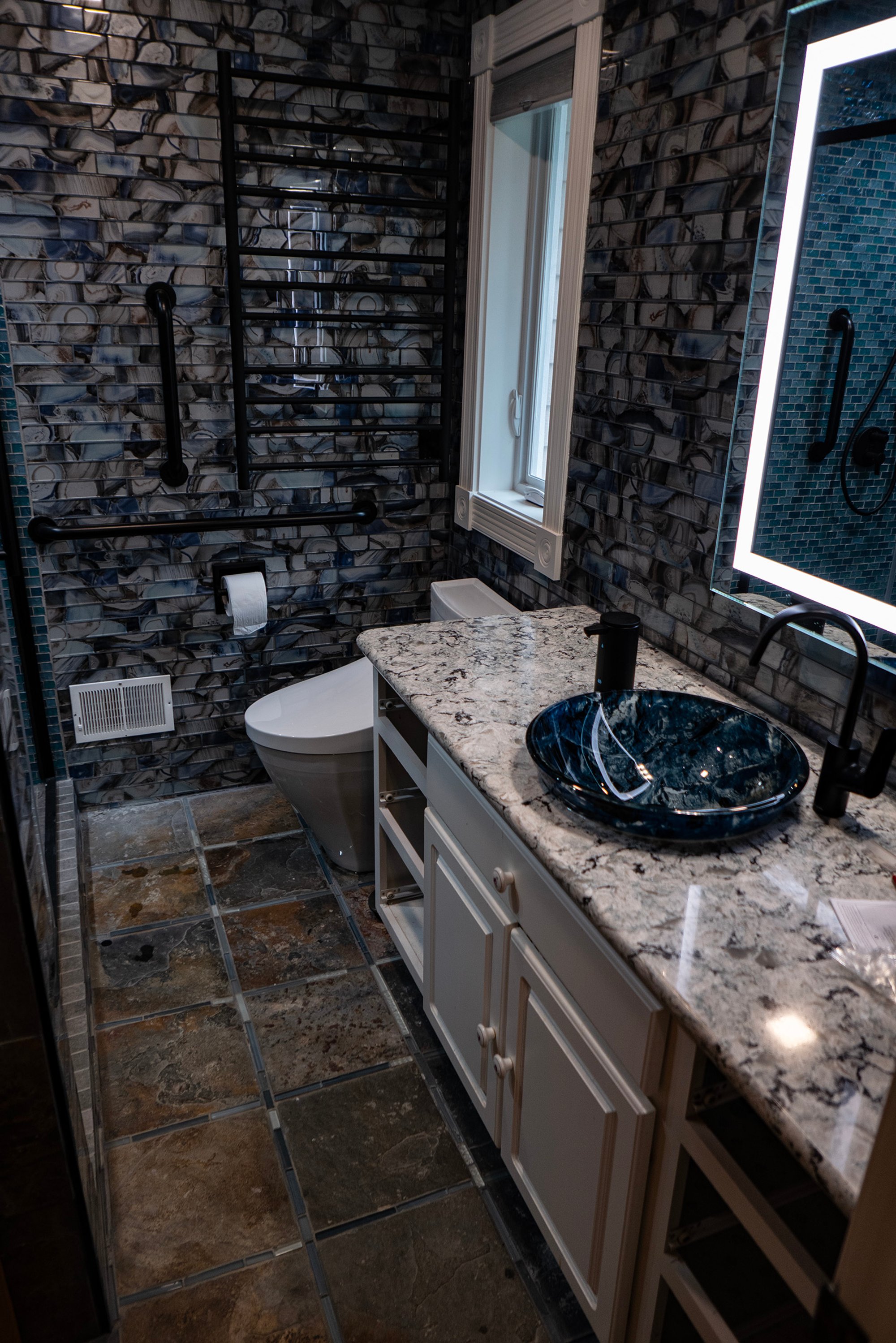 Northern Comfort: Cozying Up a Mackinac Island Bathroom with Malta Towel Warmer and Floor Heating