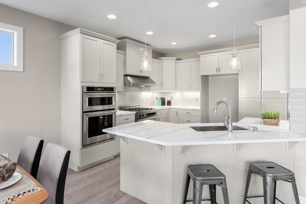 Modern Kitchen with Marble countertops and wood floor