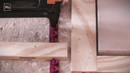 Nailed hardwood floor installation of fixing strips with stable gun