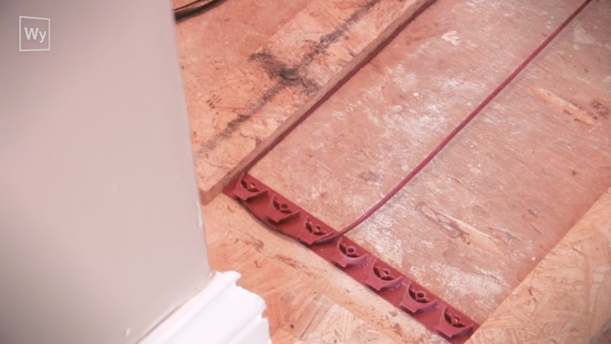 Nailed hardwood floor installation with floor heating cable