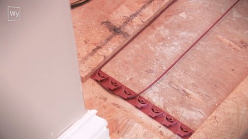 Nailed hardwood floor installation with floor heating cable