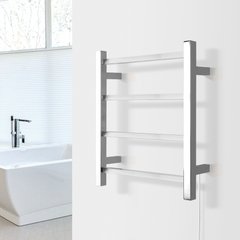 A wall-mounted Palma towel warmer with four square horizontal bars in a polished stainless steel finish installed in a modern bathroom.