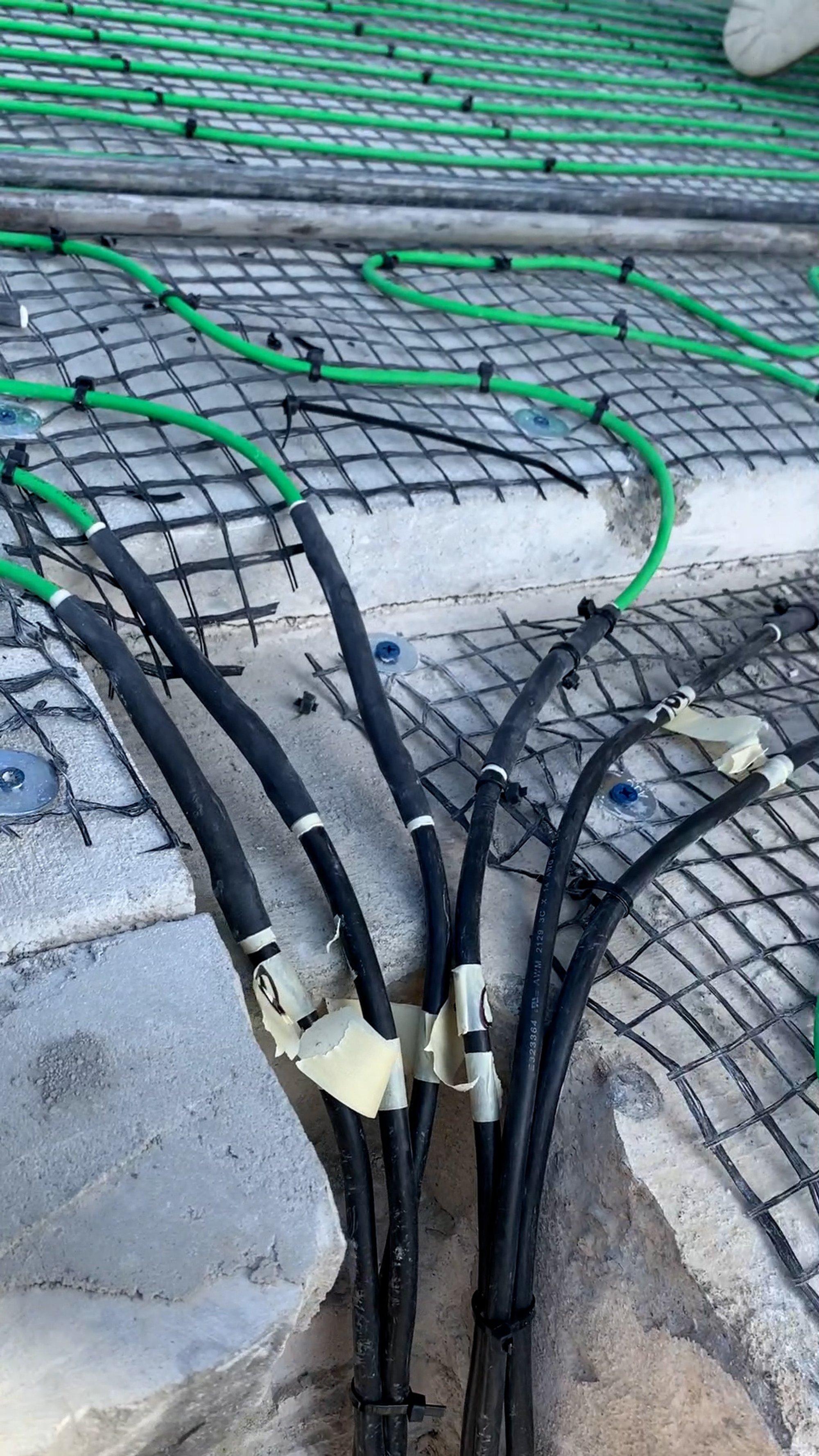 Paver snow melt installation for heated stairs and terrace SmartInstall cold leads closeup