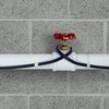 Pipe freeze protection heating cable installed on plastic pipe close