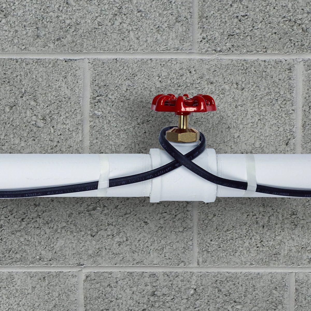 Pipe freeze protection heating cable installed on plastic pipe close