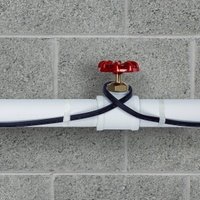 Pipe freeze protection heating cable installed on plastic pipe close