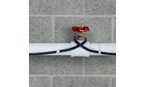 Pipe freeze protection heating cable installed on plastic pipe close