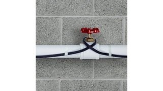 Pipe freeze protection heating cable installed on plastic pipe close