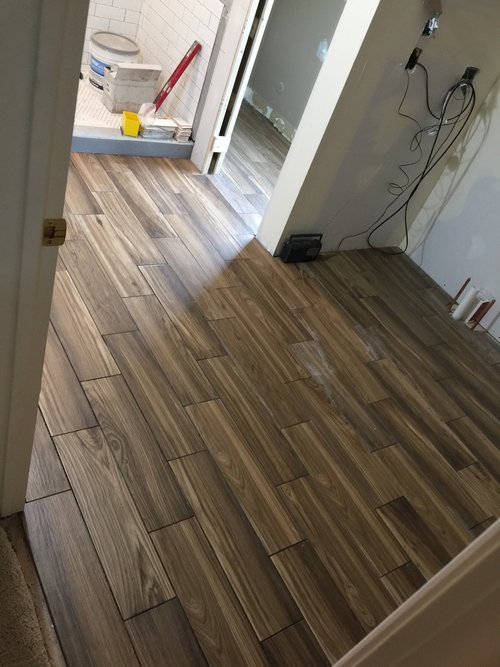Post-install shot of prodeso Uncoupling Membrane with Electric floor heating cable for a bathroom