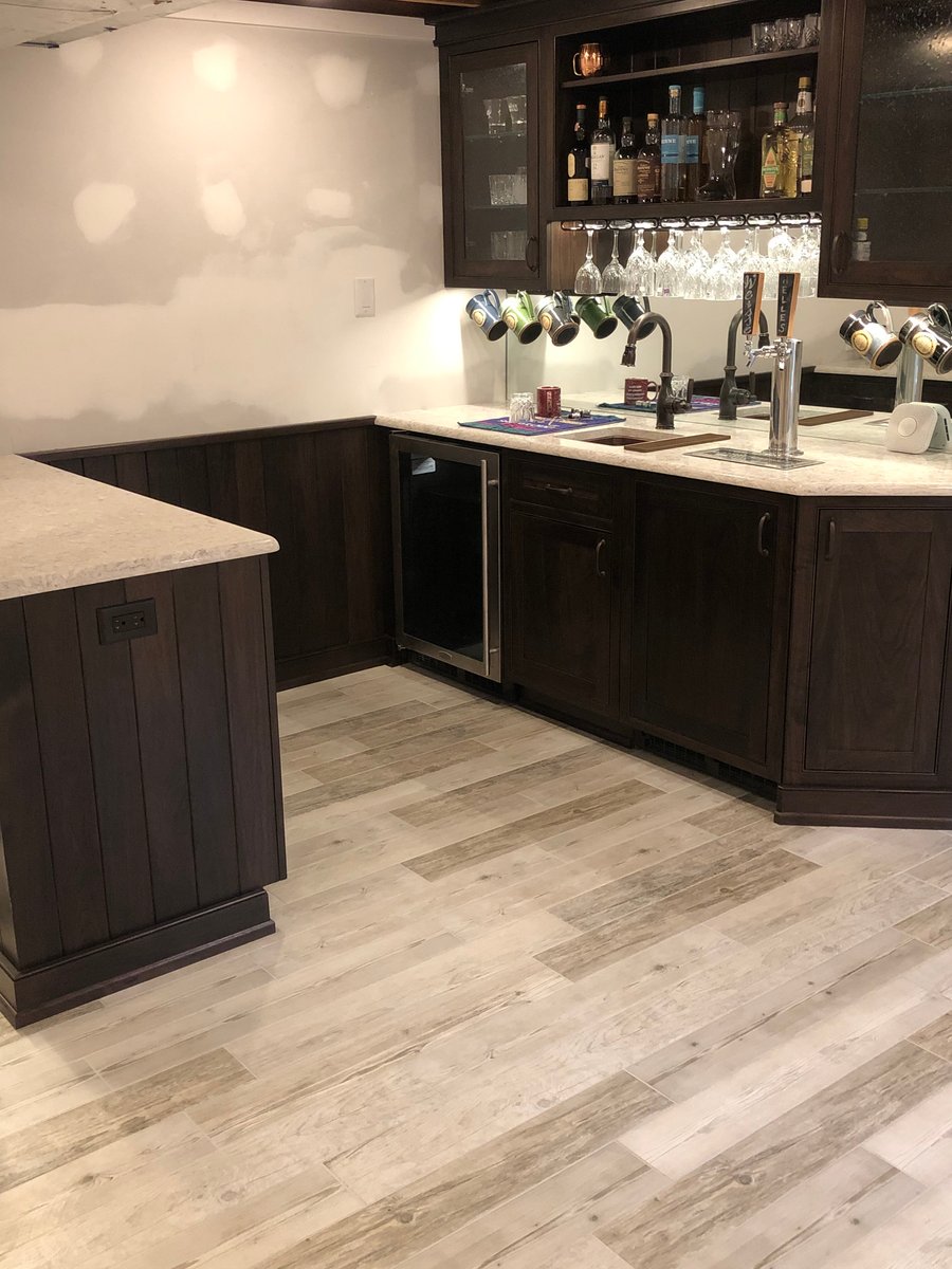 Post installation of Tempzone Flex Rolls under wood look floor tile for a home bar