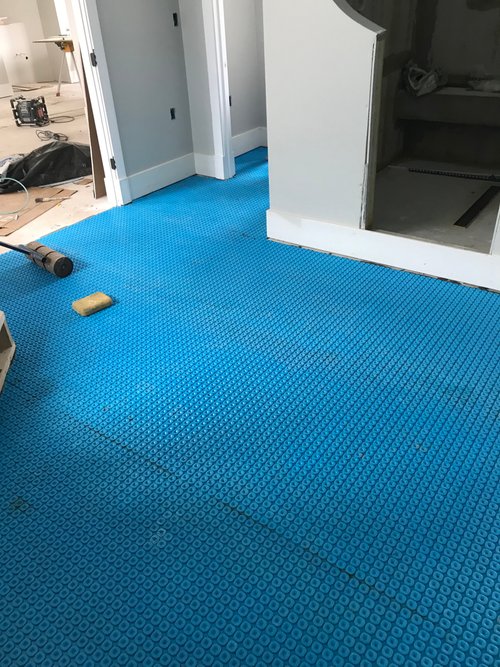 Prodeso being installed with roller over thinset PERRY HALL, MD