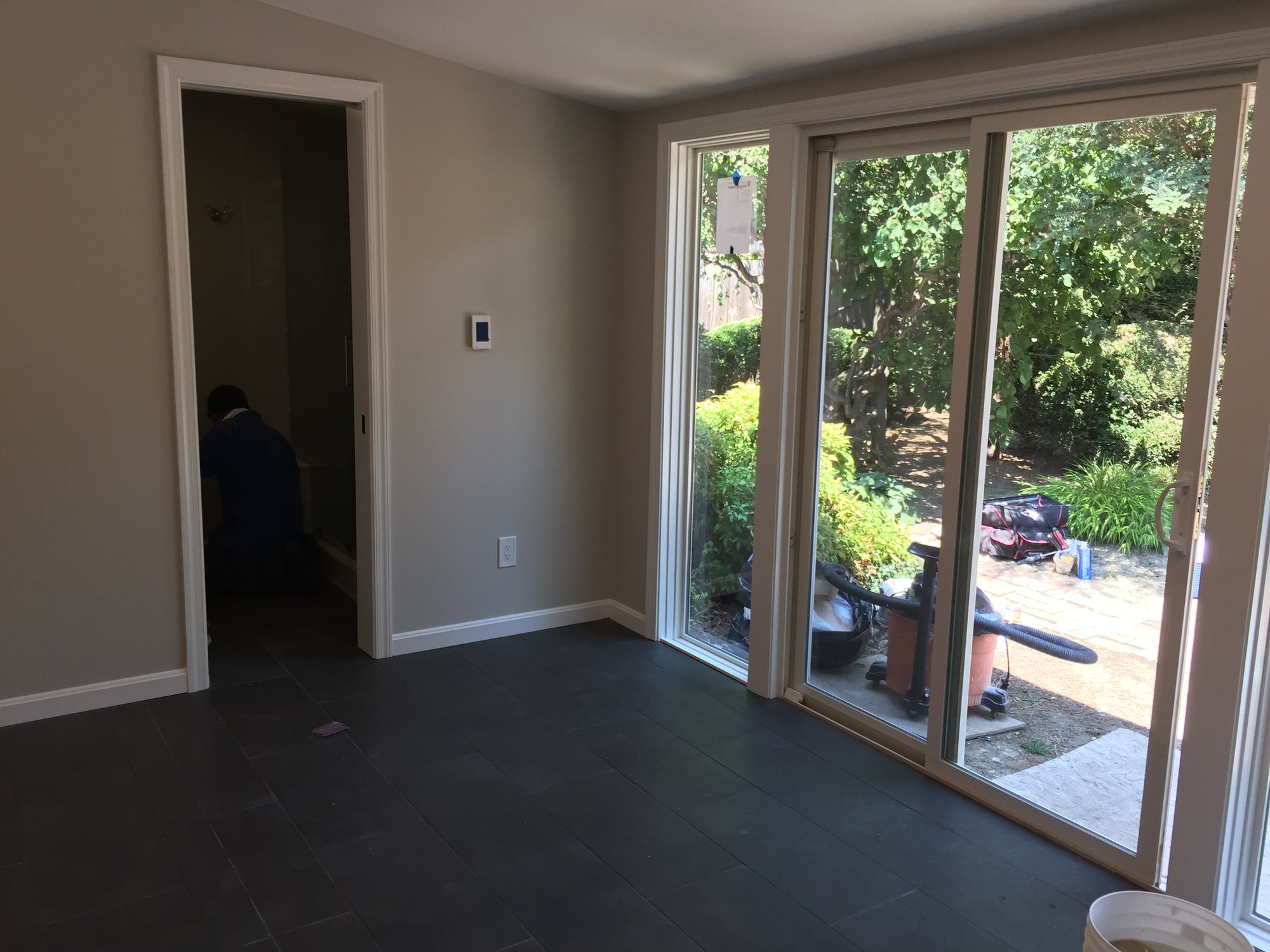 Recreation room with adjoining bathroom featuring electric floor heating after shot ALEXANDRIA, VA