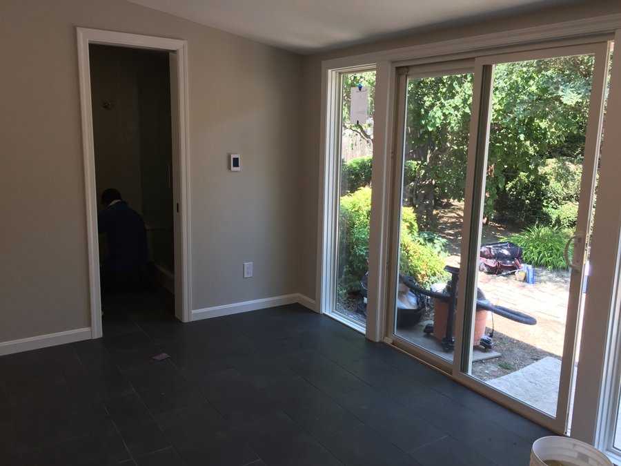 Recreation room with adjoining bathroom featuring electric floor heating after shot ALEXANDRIA, VA