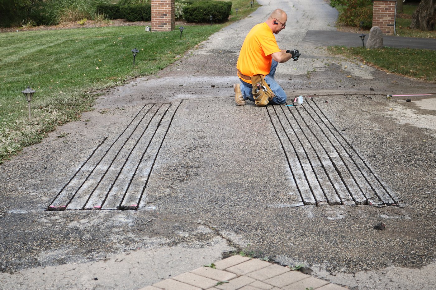 Learn how to install a snow melting system in an existing asphalt driveway.