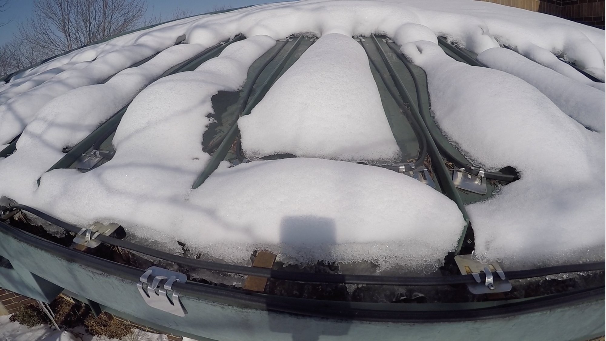 Roof and gutter deicing system at work for office roof