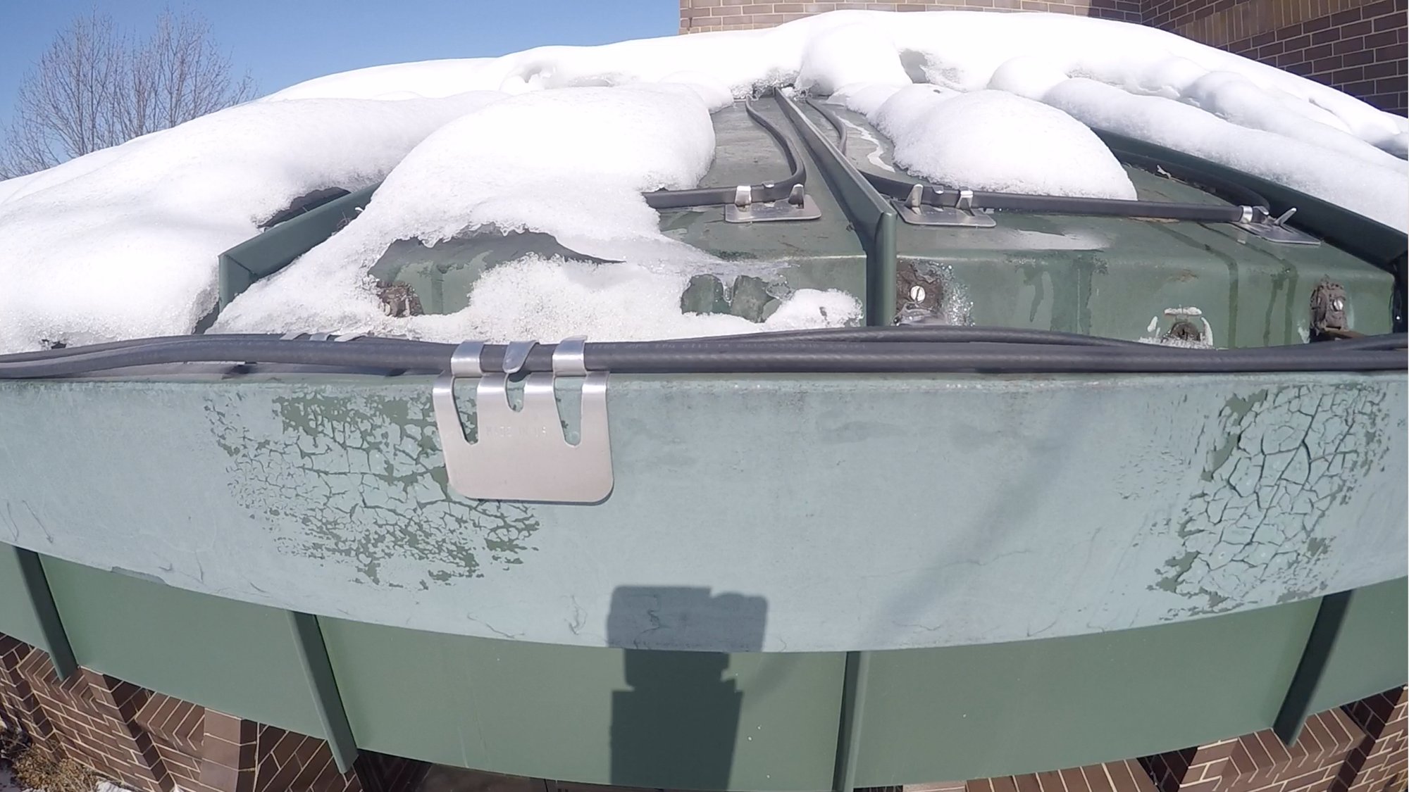 Roof and gutter deicing system at work for office roof