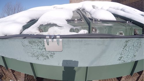 Roof and gutter deicing system at work for office roof
