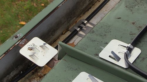 Roof and Gutter installation for WarmlyYours Office clips on roof and in gutter