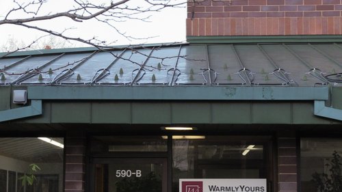 Roof and Gutter installation for WarmlyYours Office front of building