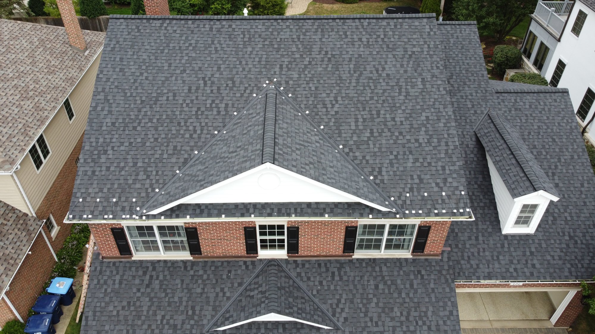 Roof and gutter installation top view from front of house