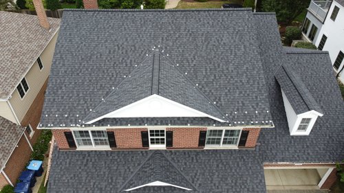 Roof and gutter installation top view from front of house