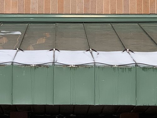 Roof and gutter installation with constant wattage top of roof at warmlyyours office