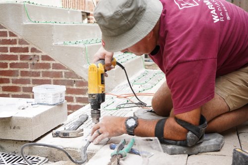 securing georgrid underlayment for snow melt install at top of stairs EVANSTON, IL