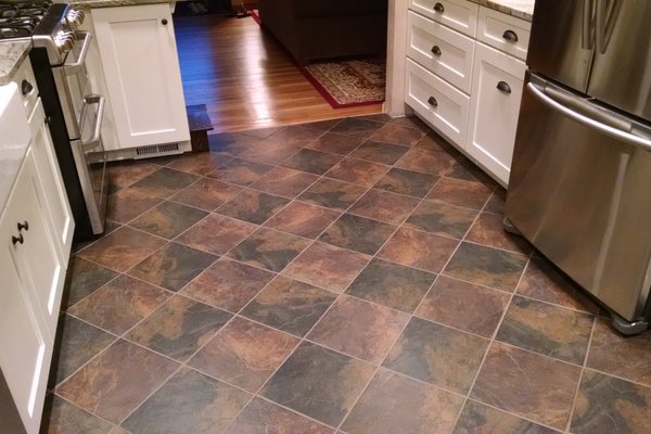 Finished kitchen floor with beautiful tile installed over TempZone electric radiant heating system.