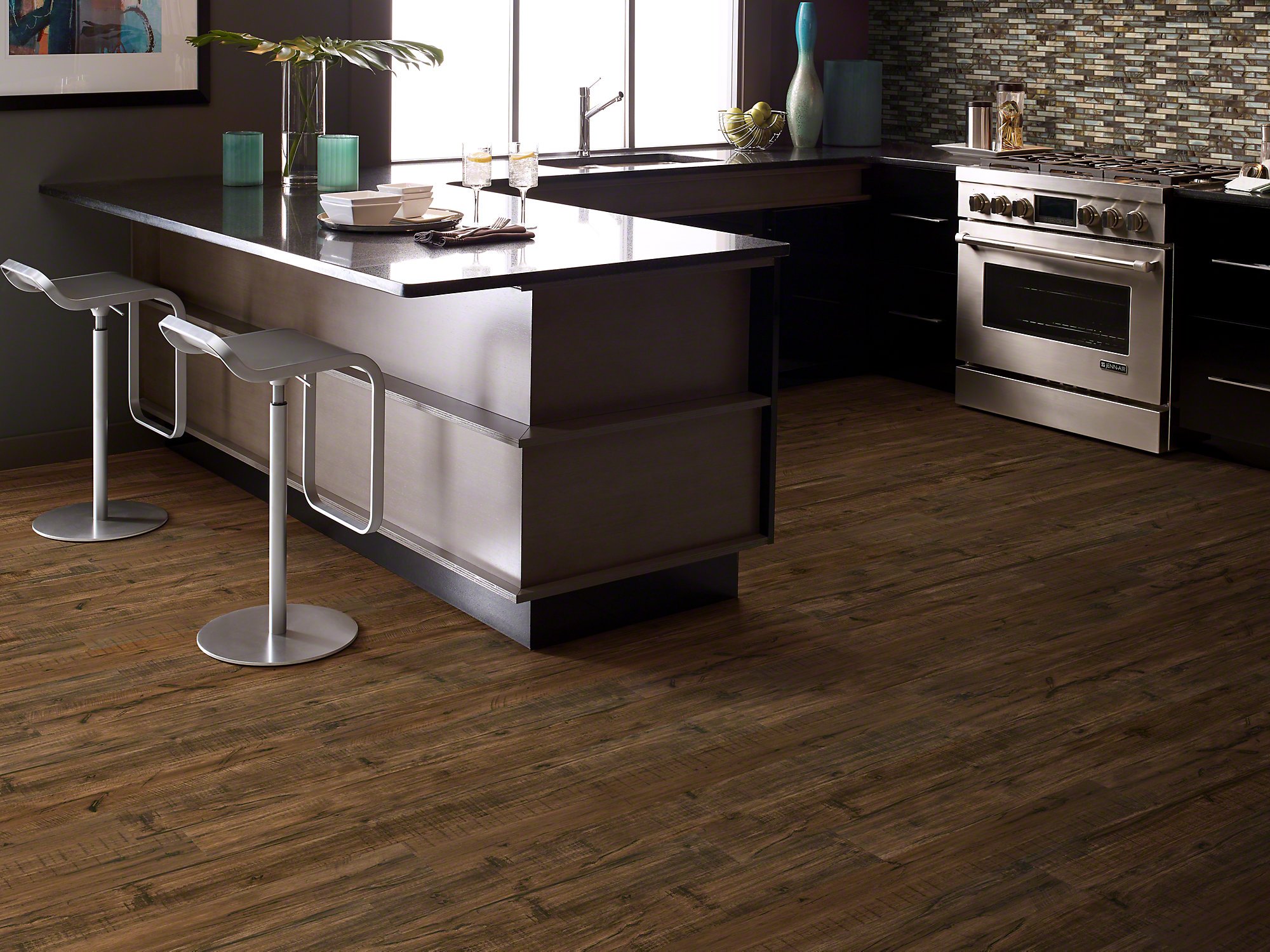 Modern kitchen with luxury vinyl plank flooring installed over an electric radiant floor heating system.
