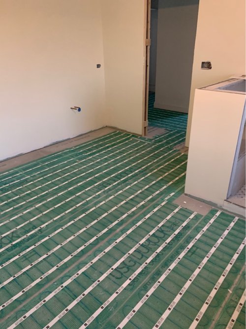 SmartInstall of Floor Heating for a Master Bathroom flex roll during installation CARY, IL