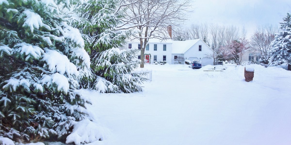 Snow covered house and yard
