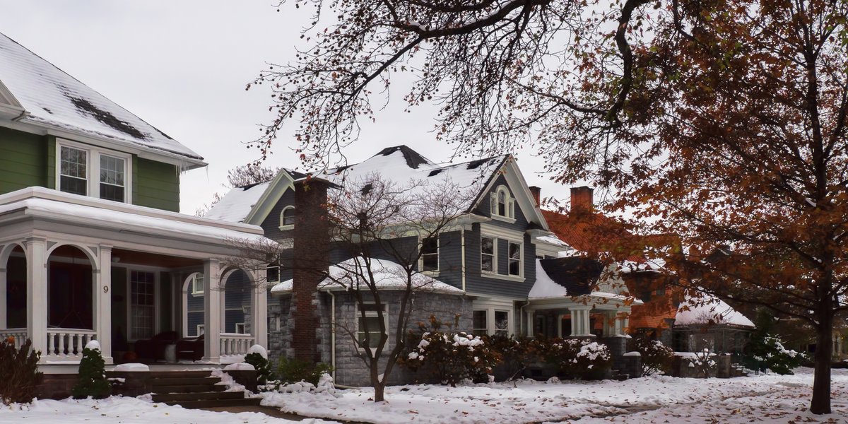 Snow-covered residential home in Rochester, NY during winter
