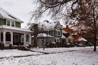 Snow-covered residential home in Rochester, NY during winter